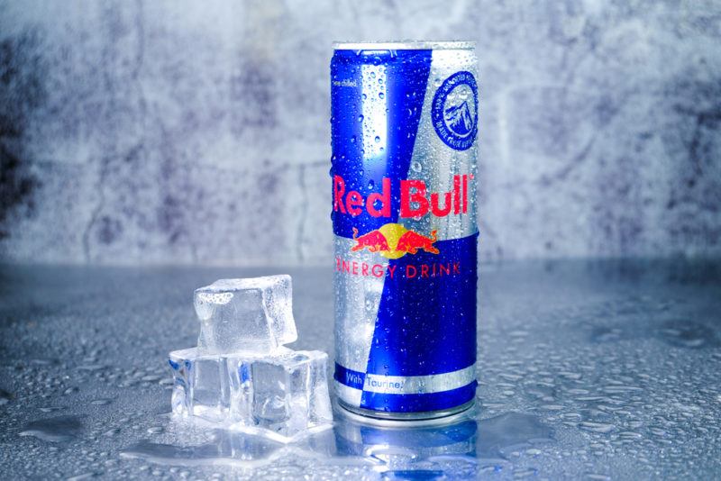 Red Bull energy drink next to ice