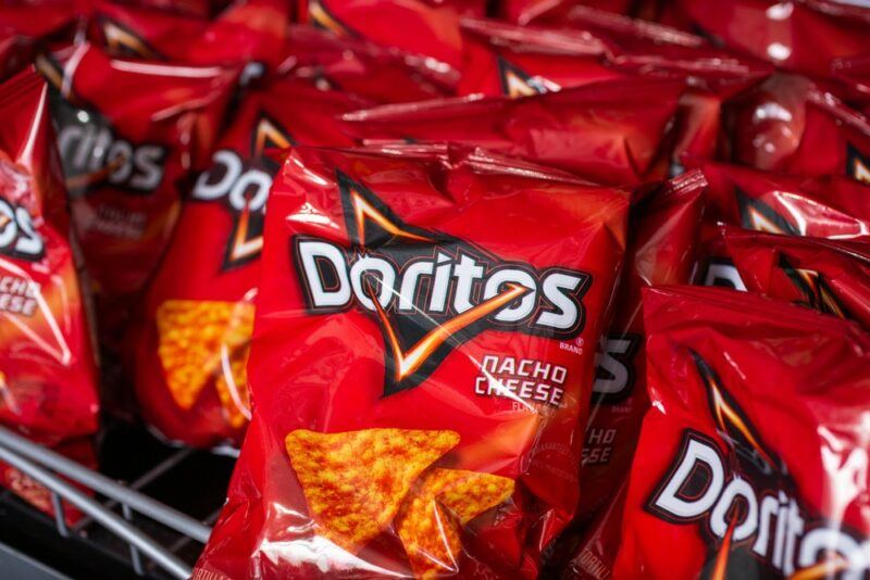 Bags of red Doritos in a grocery store