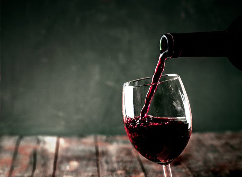 Red wine being poured into a glass