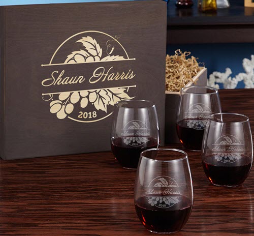 Rhode Valley Wine Glass Gift Set | Food For Net Four wine glasses on a wooden table with a box