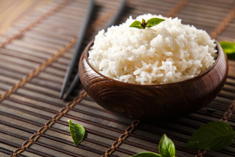 A brown bowl of white rice