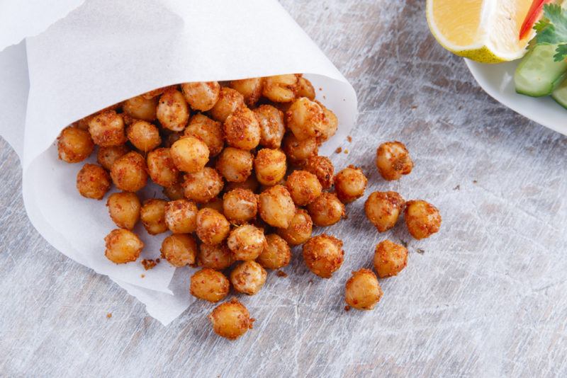 Roasted chickpeas spilling out of a bag