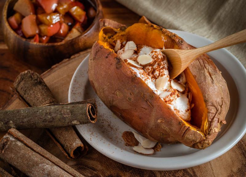 A roasted sweet potato with apples and cinnamon