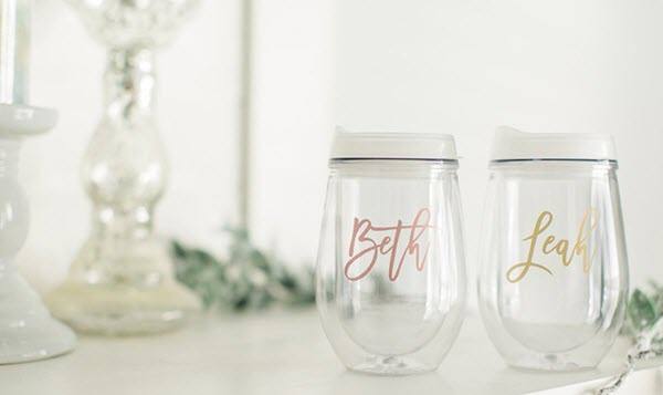 Rose Gold Wine Tumbler | Food For Net Two clear tumblers, one with gold font and one with rose gold