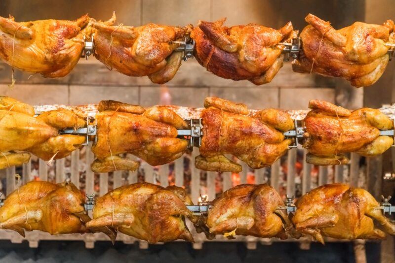 Rotisserie chickens cooking in a store