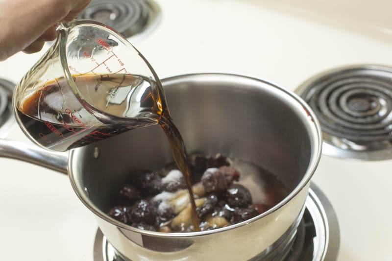 rum-poached-cherries-pour-rum-sugar-stove