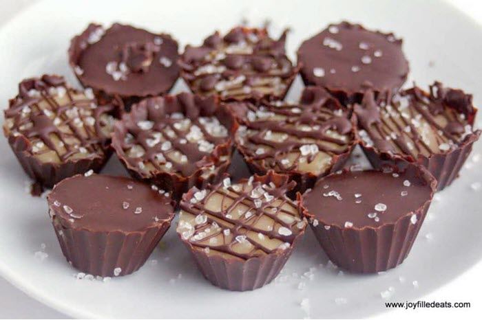 A plate of chocolate fat bombs, some with criss crossed lattice