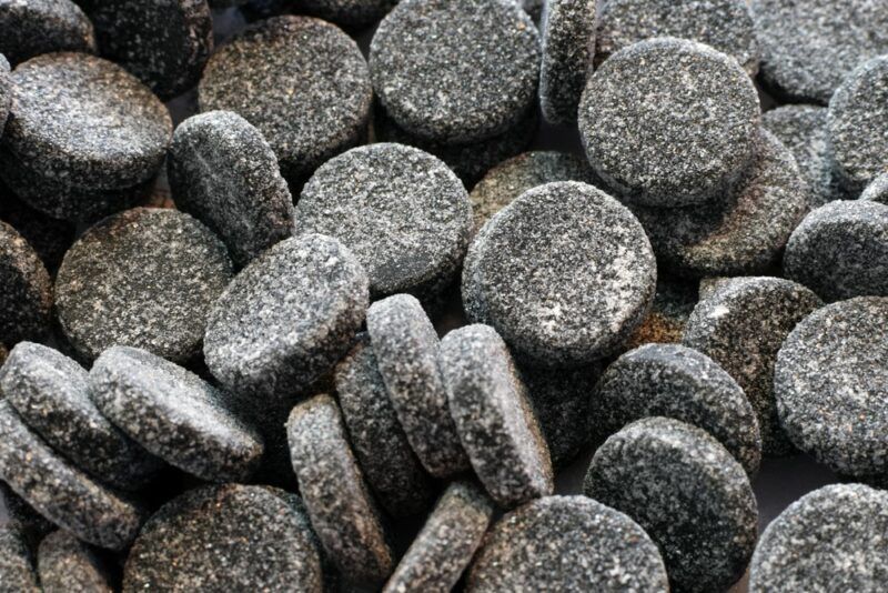 Circular pieces of salty licorice that is also called salmiakki