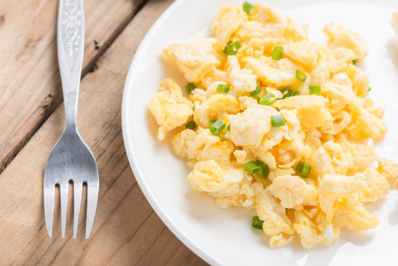 Scrambled eggs on a white plate