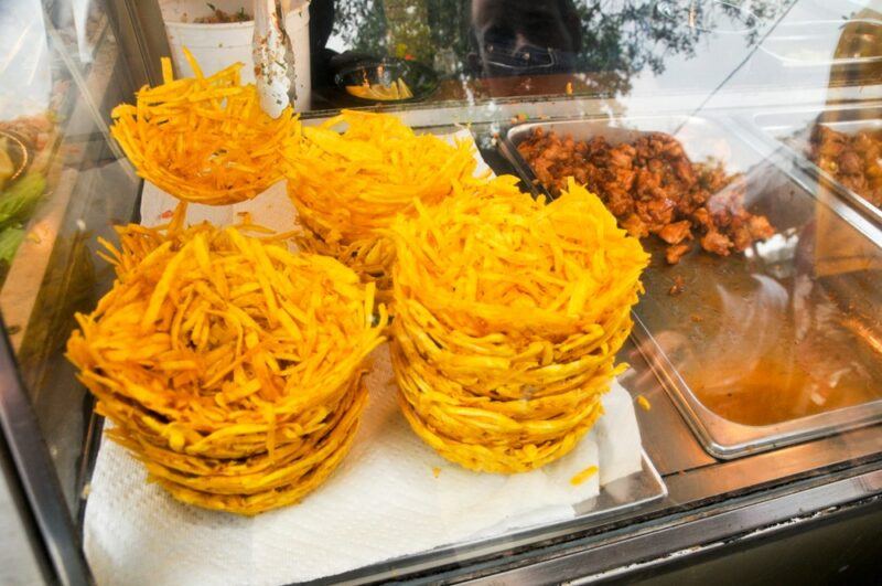 Shredded plantain cakes called aranitas in a shop window