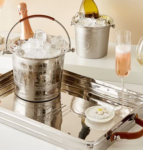 Silver And Leather Ice Bucket | Food For Net A silver ice bucket on a tray