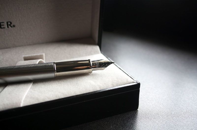 Pen of the Month Subscription Boxes - Silver ornate fountain pen displayed in a black box with white felt interior