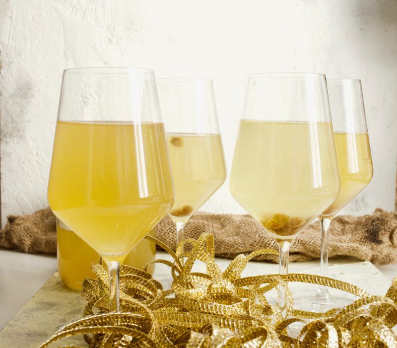 Four glasses of sima on a light background