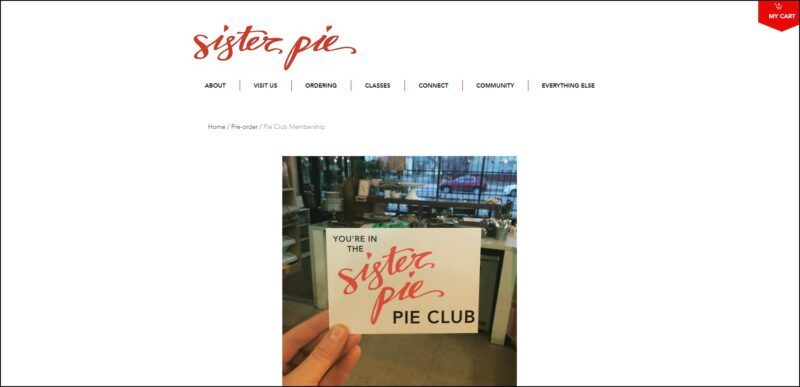 screenshot of Sister Pie's Pie Club's web page, dominantly white page with the website's red-colored name on top, underneath it is the main menu, the page is showing a large picture of a card with text 