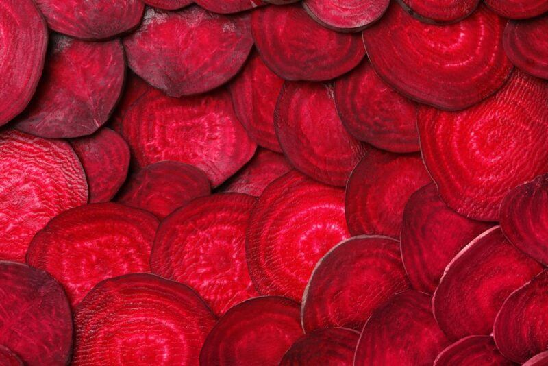 Thin slices of beets layered on top of each other.