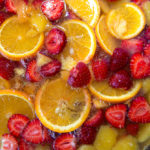 Fresh fruits being soaked in grain alcohol for a jungle juice cocktail