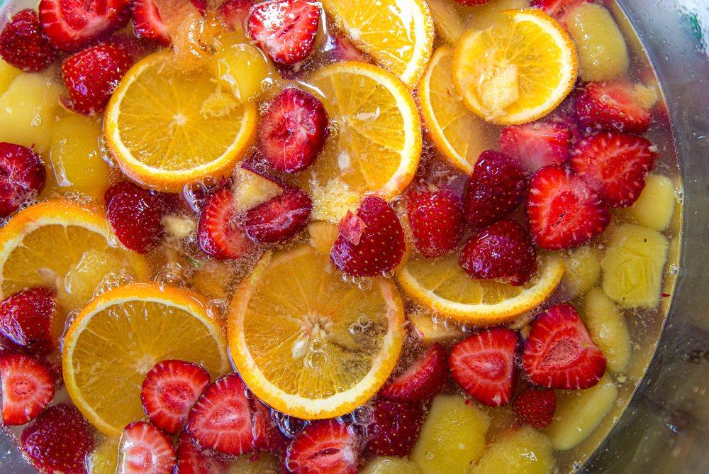 Fresh fruits being soaked in grain alcohol for a jungle juice cocktail