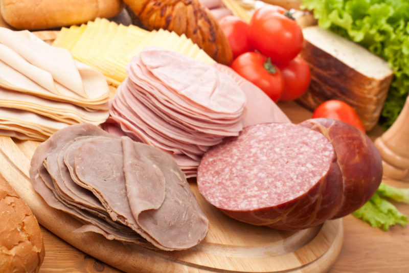 Sliced lunch meat with cheese | Food For Net Sliced lunch meat on a board, including beef, ham, chicken, and salami