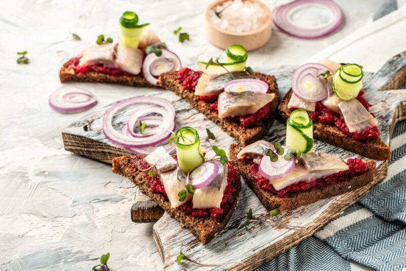 Slices of bread as appetizers with onions and cucumbers