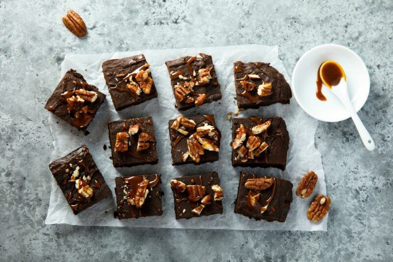 Squares of brownies with pecans on top