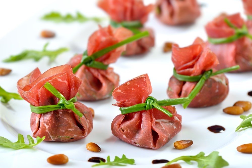 A selection of packages made of beef tied with chives