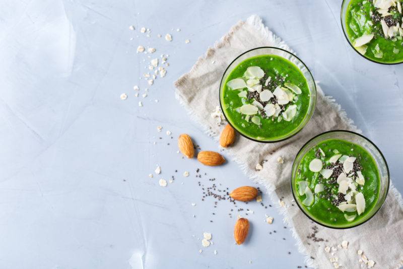 Three matcha smoothies with toppings