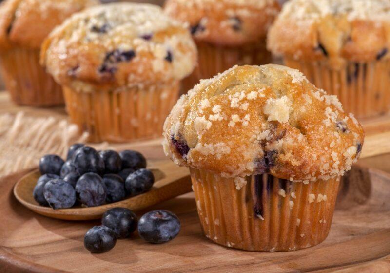 Four types of muffins with fresh blueberries