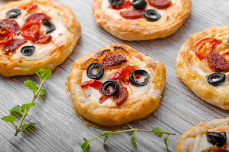 A selection of mini pizzas on a table