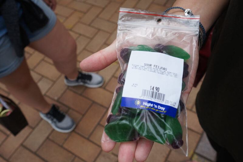 Someone holding a bag of sour feijoa candy