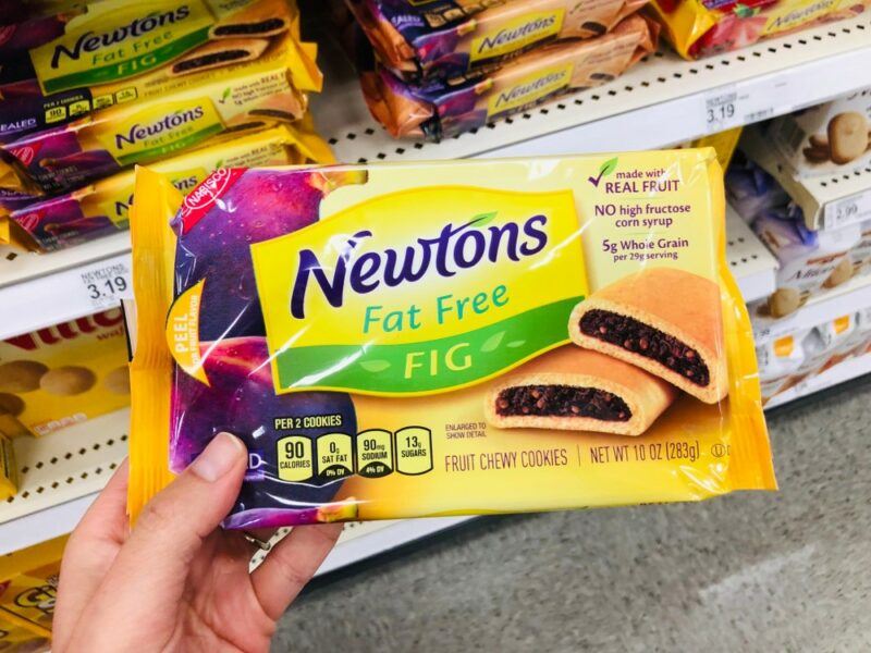 Someone holding a pack of fat free Fig Newtons in a grocery store