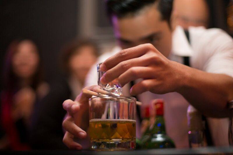 A bartender making a Vegas bomb cocktail