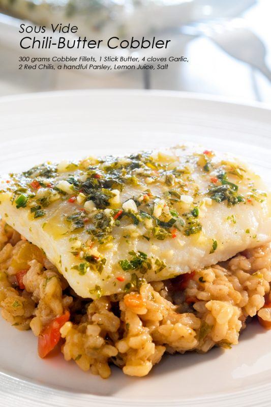 A large white plate, with flavored rice and a large piece of chili-butter cobbler with plenty of herbs as a garnish. 