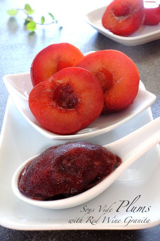 A small white plate with three plums and a white spoon containing plum granita