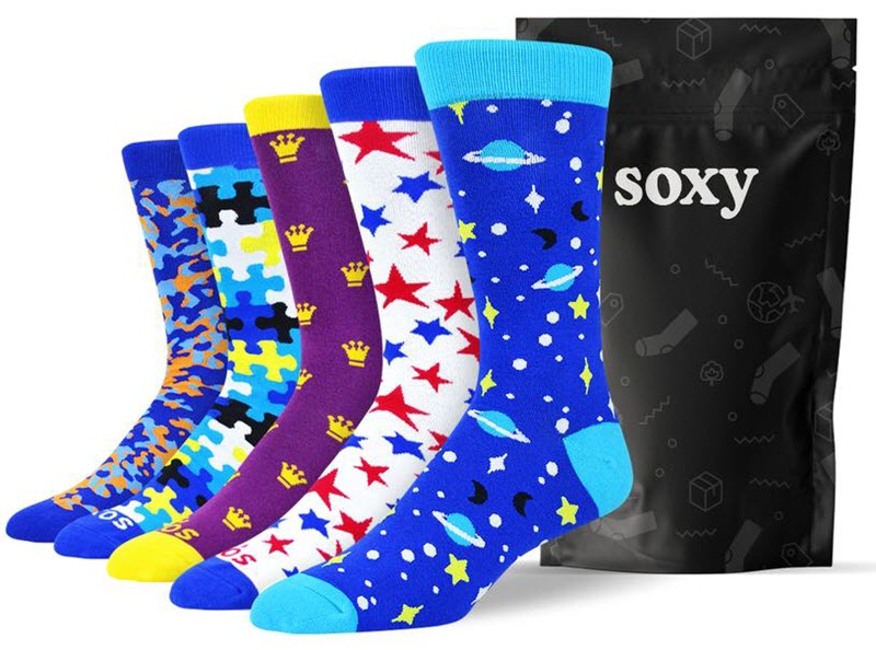 An image from the Soxy Sock site, showing five different brightly colored socks on fot models, next to a black Soxy bag