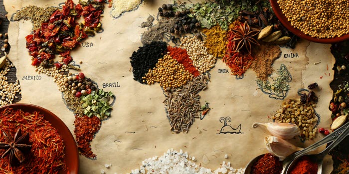 A selection of spices on a world map