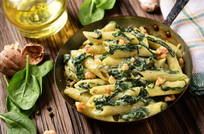 A dish containing spinach and pasta