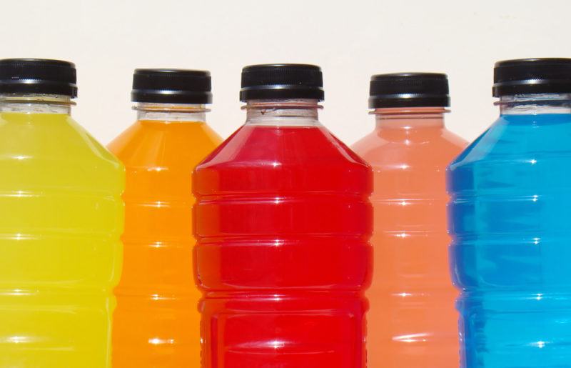 Pastic bottles containing brightly colored sports drinks