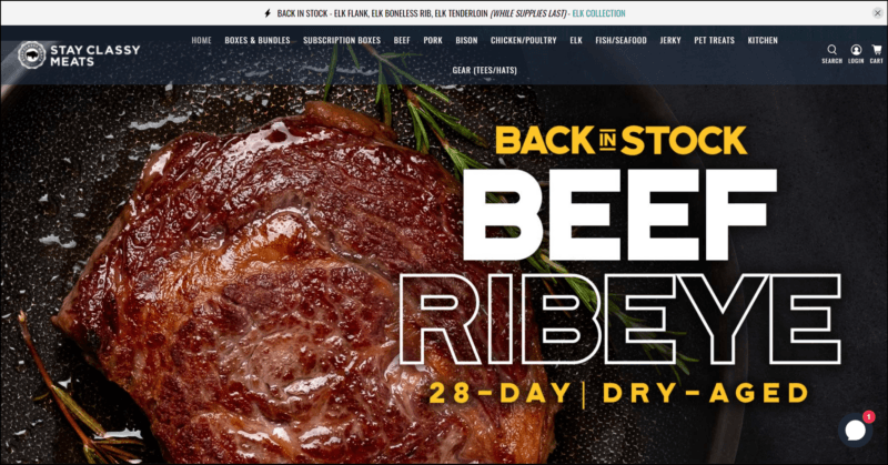 screenshot of Stay Classy Meats Subscription Boxes' web page with white announcement bar on top followed by the header with the website's name/logo with the navigation menu, content area has an image of a cooked rib eye with text overlay