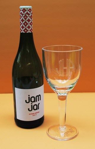 Stemmed Wine Glass With Text | Food For Net An engraved wine glass next to a bottle of wine