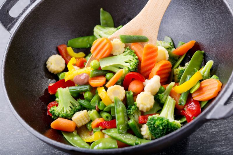 Stiring and reheating veggies in a wok