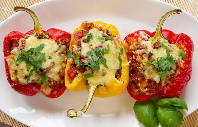 Bell peppers stuffed with mince and topped with cheese