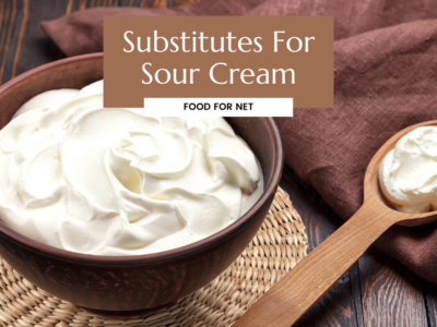 A large wooden bowl and wooden spoon containing sour cream or one of the many substitutes for sour cream.