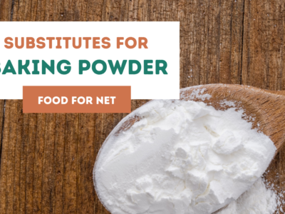 A large wooden spoon of baking powder, looking at the various substitutes for baking powder.