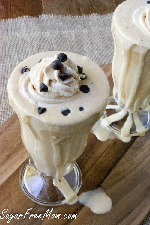 Two pumpkin smoothies on a wooden table