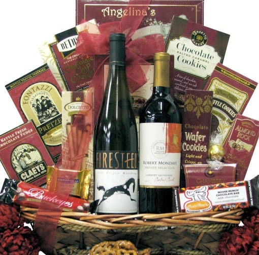 Sweet Selections Gourmet Wine & Chocolate Gift Basket | Food For Net A basket containing many red-themed snacks and two bottles of wine