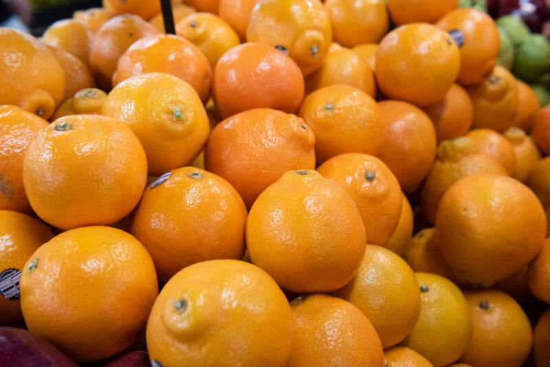 a pile of fresh tangelo oranges