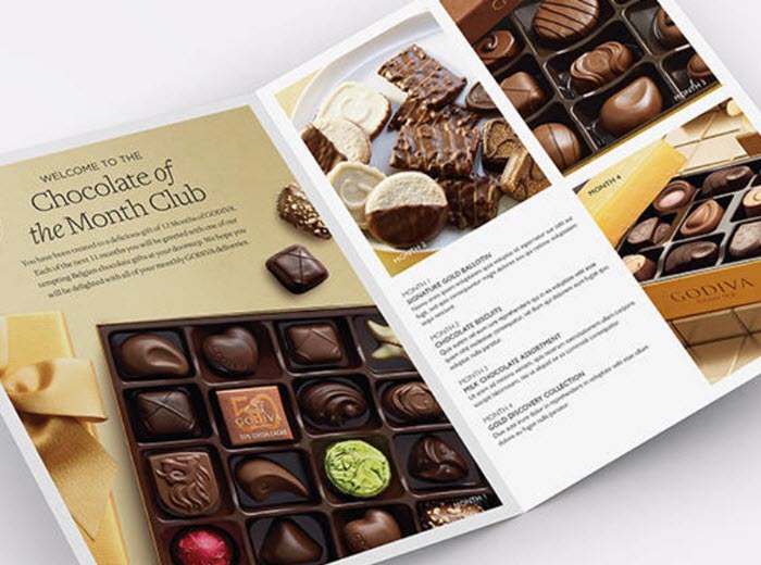 Brochure showing various boxes of Godiva chocolate