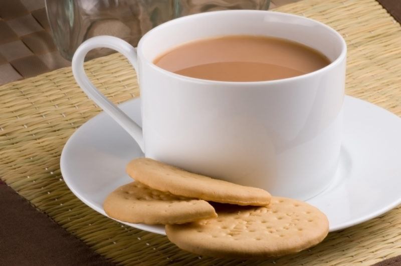 A cup of tea with biscuits