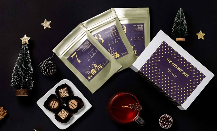 Tea and chocolates against a black background