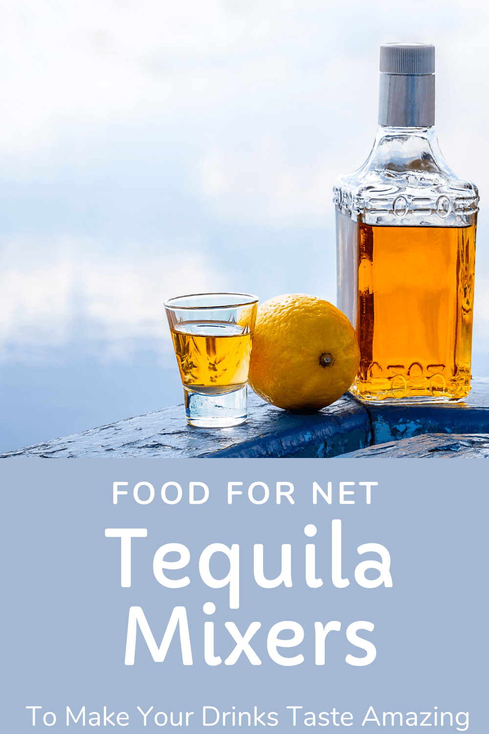 A bottle of tequila, with a lemon and a shot